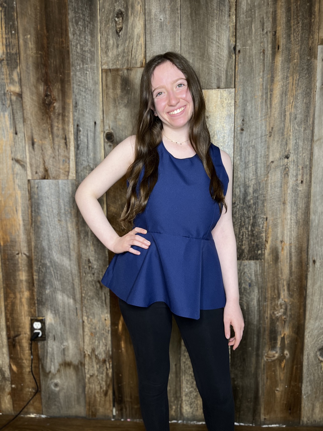Young designer in a peplum top she made
