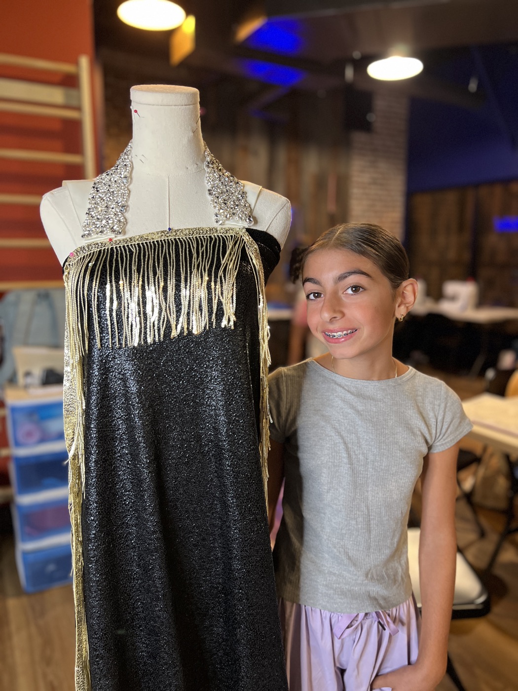 A camper sketching a fashion design