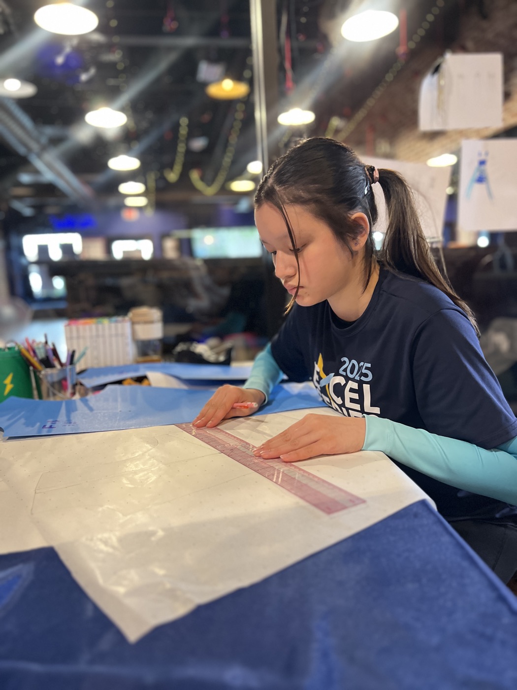 A camper working on her garment