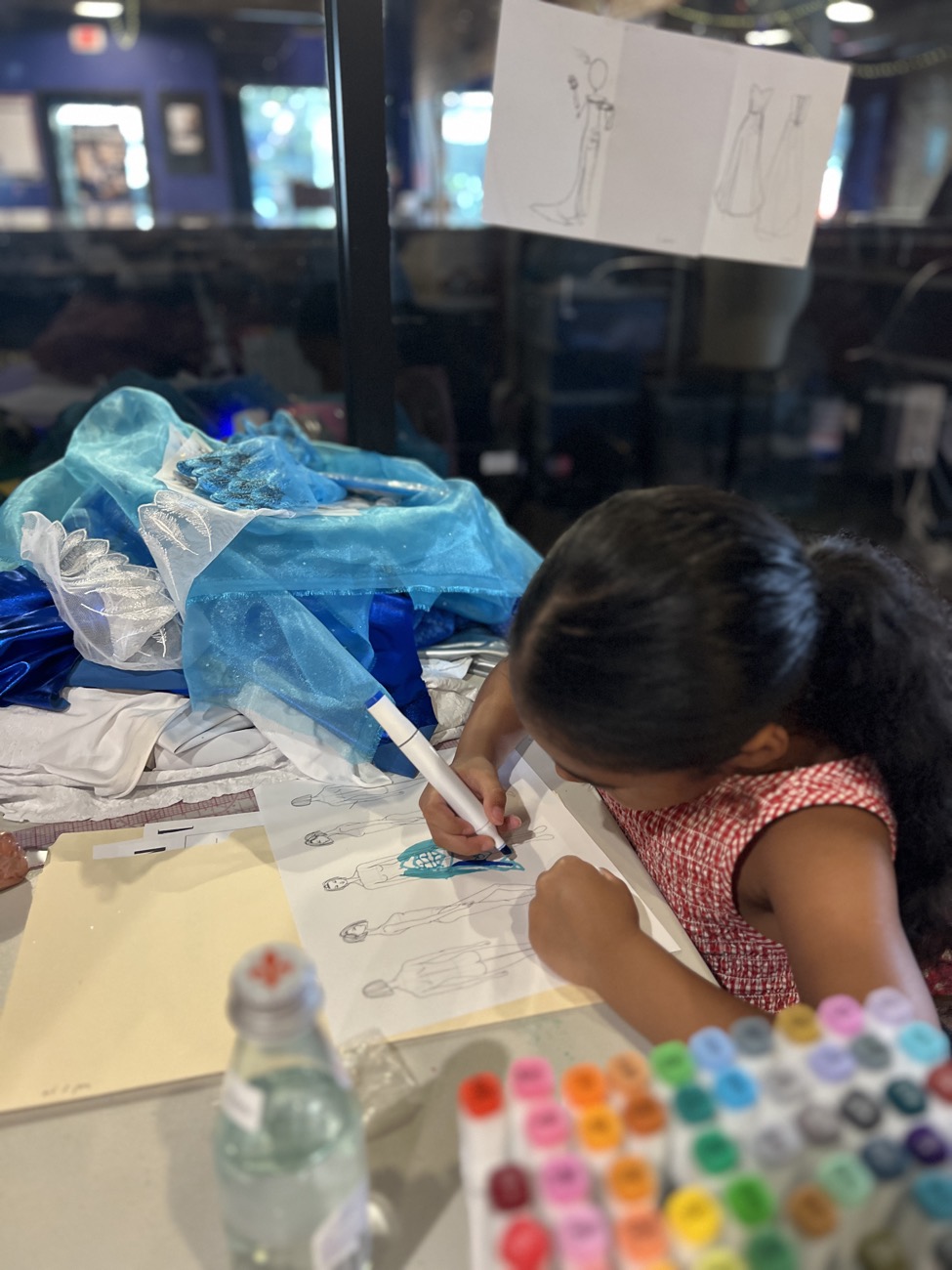 A camper sewing her garment