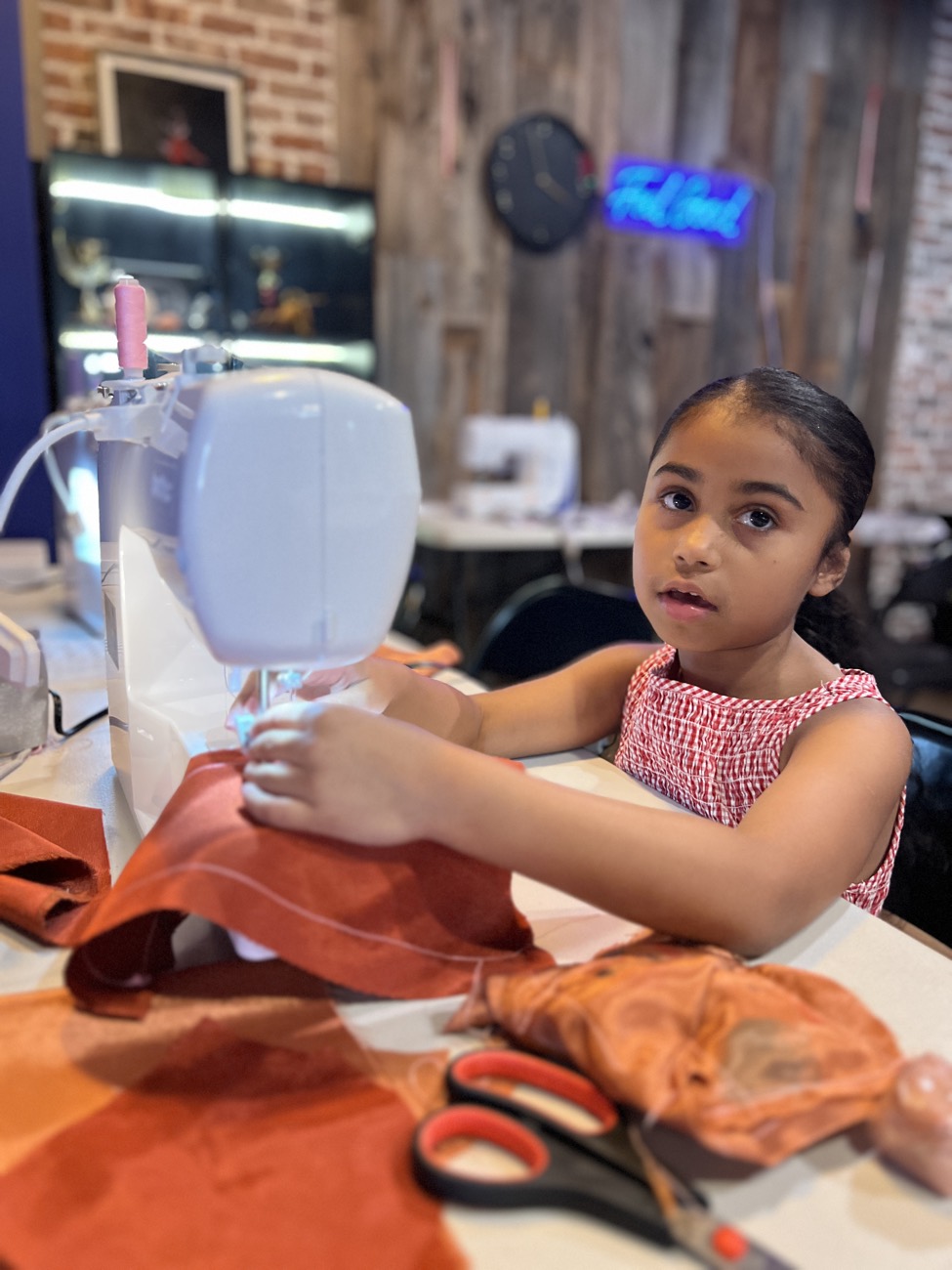 A camper focused on her design