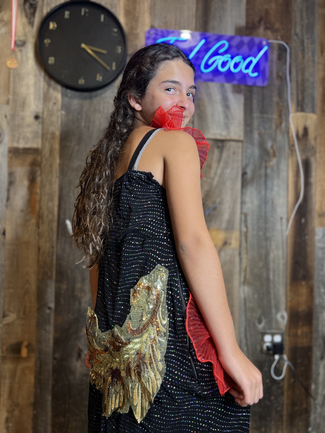 A camper models her embellished gown at the finale