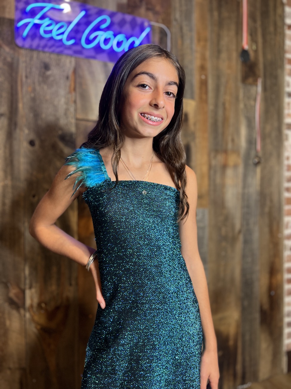 A young designer models her finished look