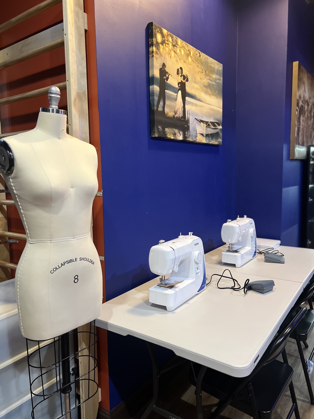 The fashion design studio with sewing machines and a dress form